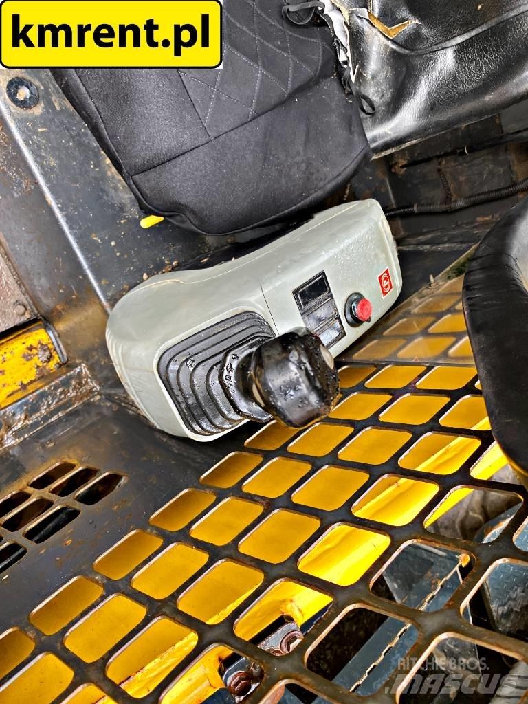 Komatsu SK 815 Smykem řízené nakladače