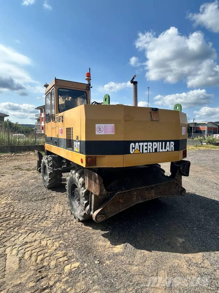 CAT 214 Kolová rýpadla
