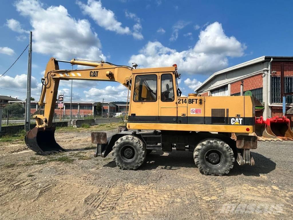 CAT 214 Kolová rýpadla