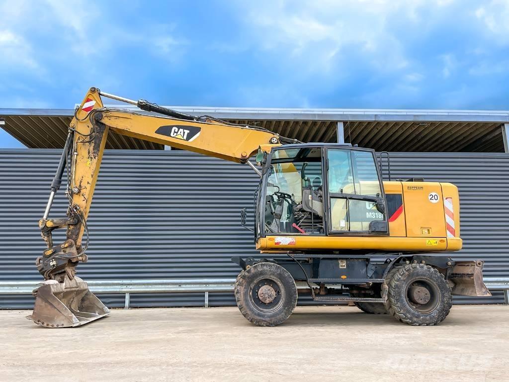 CAT M318F Kolová rýpadla