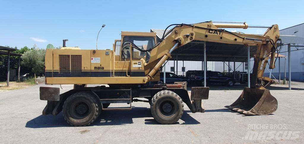 CAT 214 B Kolová rýpadla