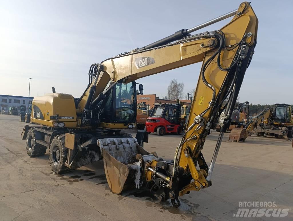 CAT M 313 D Kolová rýpadla