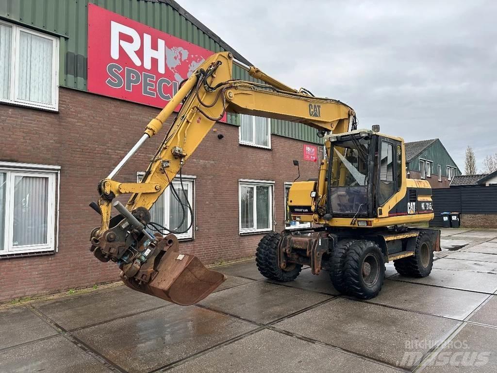 CAT M315 +ROTO CE Kolová rýpadla