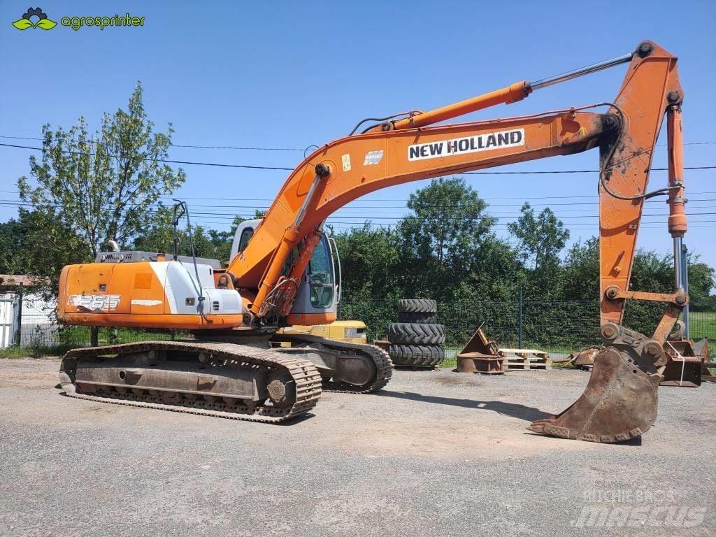 New Holland E 265 Pásová rýpadla