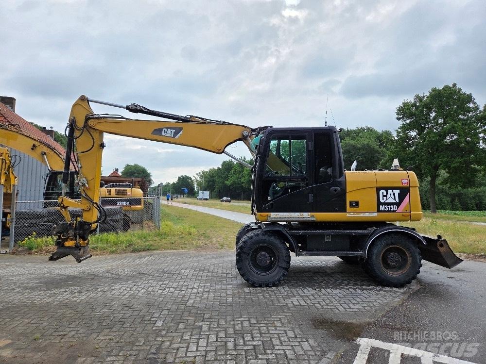 CAT M313D Kolová rýpadla