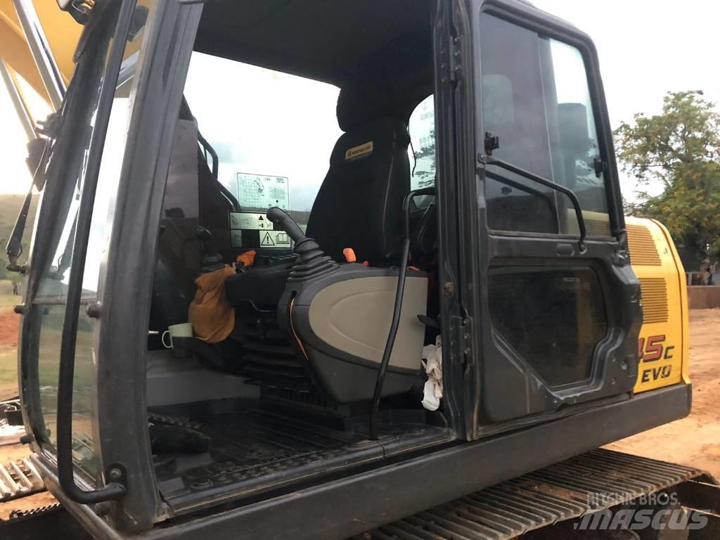 New Holland E 145 Pásová rýpadla