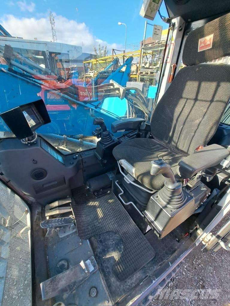 Fuchs MHL 320 Stroje pro manipulaci s odpadem