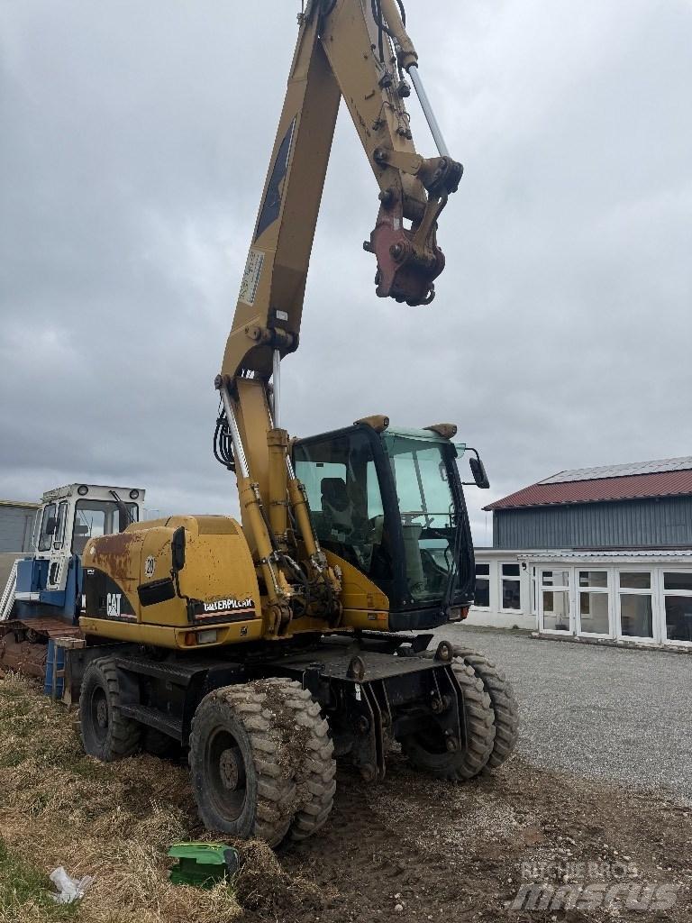 CAT M 313 C Kolová rýpadla