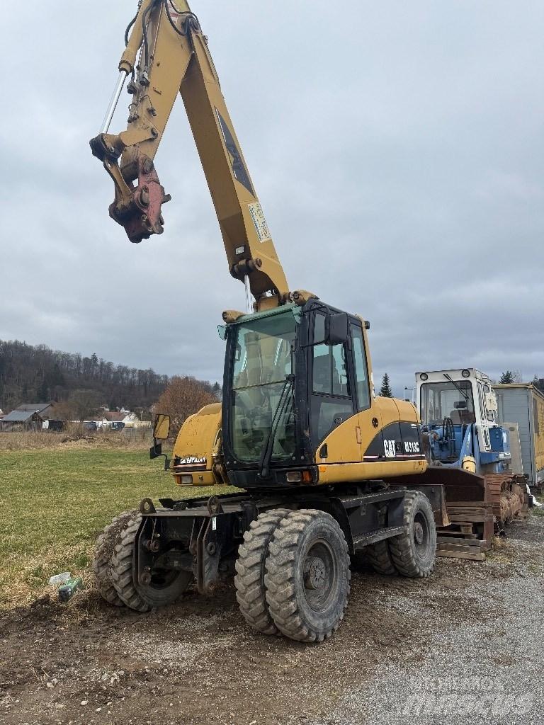 CAT M 313 C Kolová rýpadla