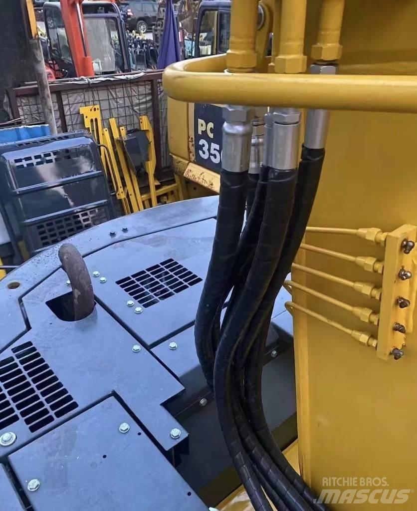 Komatsu 128 US Pásová rýpadla