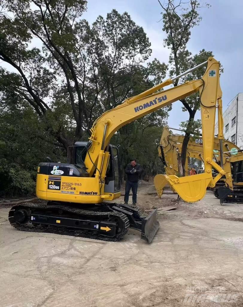 Komatsu 128 US Pásová rýpadla