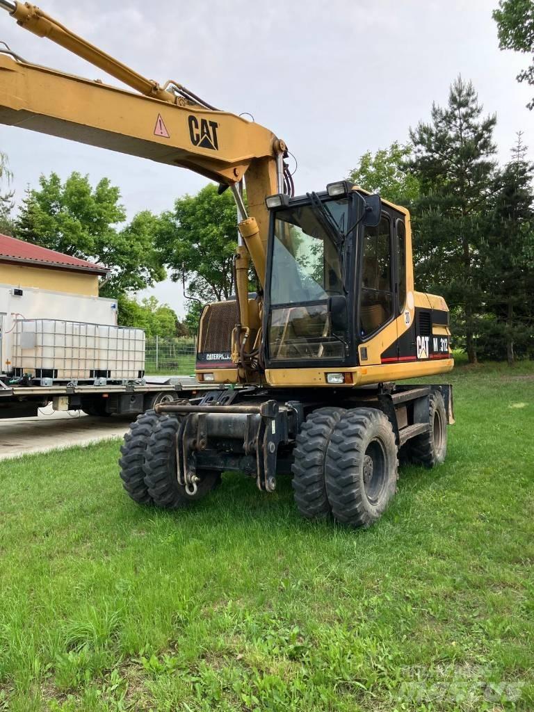 CAT M 312 Kolová rýpadla