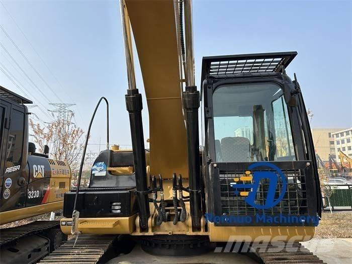 CAT 323D/323/323DL Pásová rýpadla