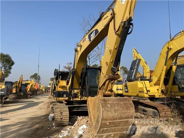 CAT 318D Pásová rýpadla