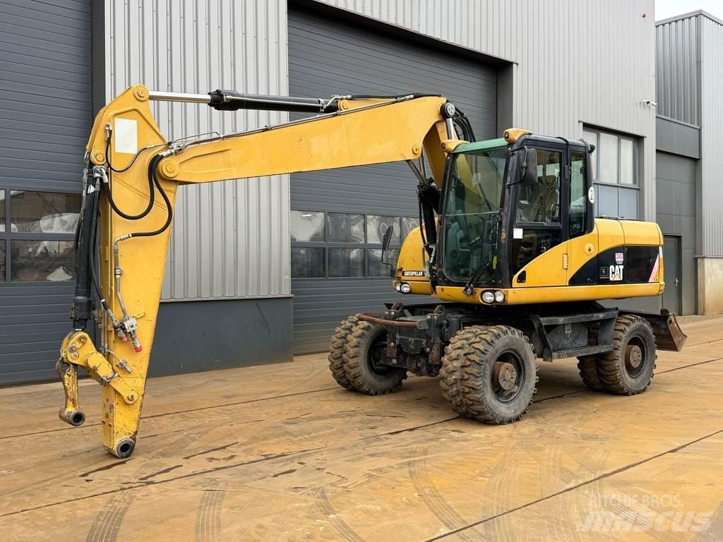 CAT M315D Kolová rýpadla