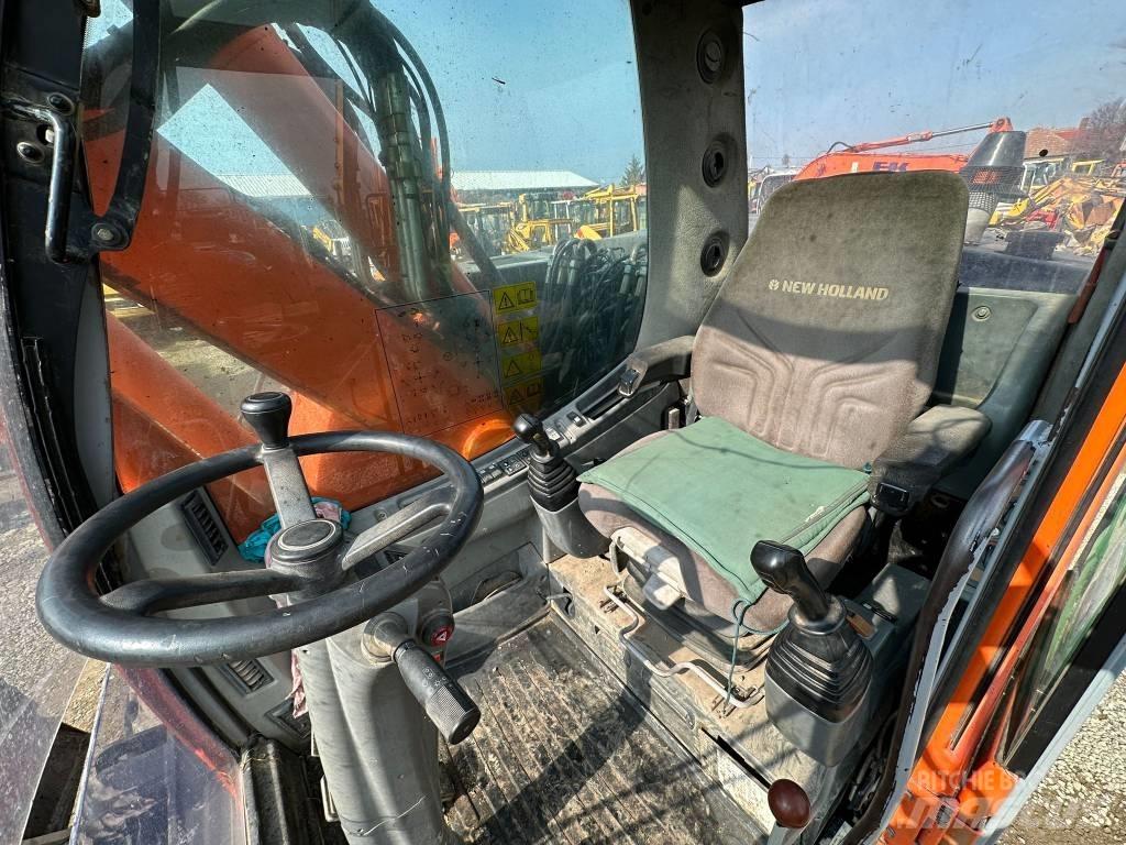 New Holland MH Plus Kolová rýpadla