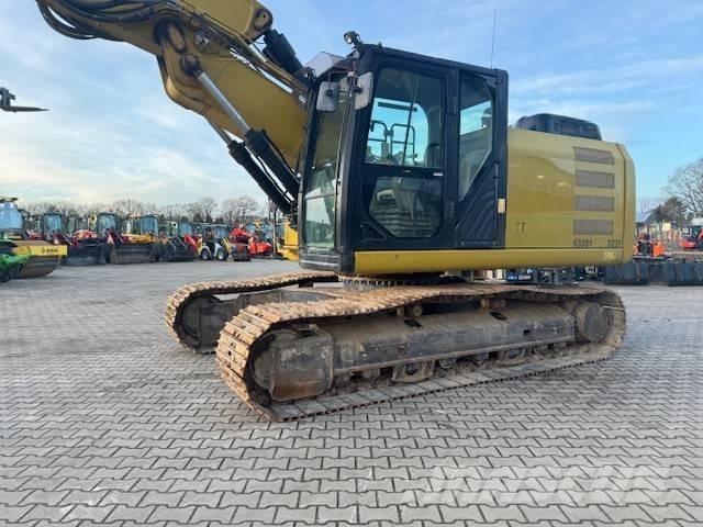 CAT 323 EL Pásová rýpadla