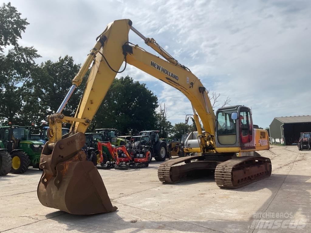 New Holland E 305 Pásová rýpadla