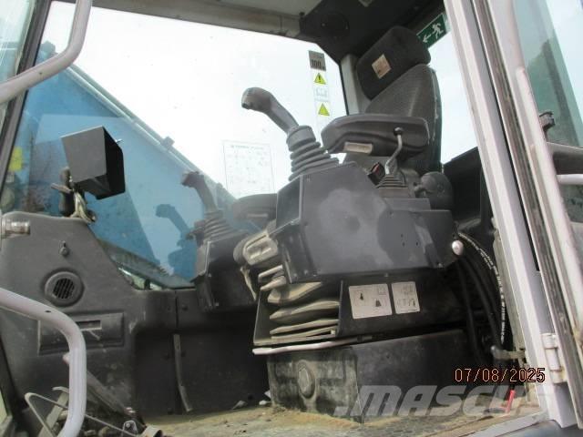 Fuchs MHL 320 Stroje pro manipulaci s odpadem