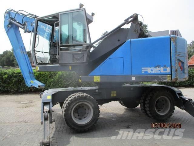 Fuchs MHL 320 Stroje pro manipulaci s odpadem