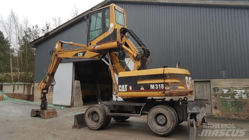 CAT M 318 Stroje pro manipulaci s odpadem