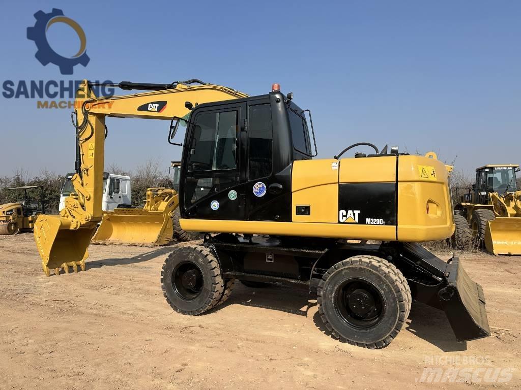 CAT M320D Kolová rýpadla