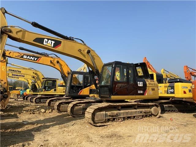 CAT 323D Pásová rýpadla