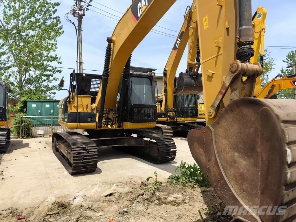 CAT 323 D Pásová rýpadla