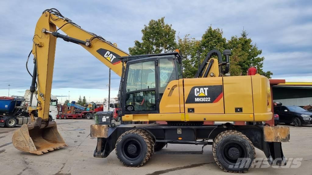 CAT MH 3022 Stroje pro manipulaci s odpadem