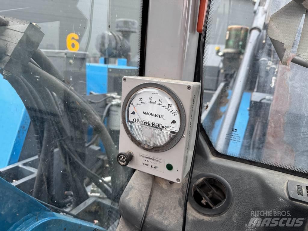 Fuchs MHL 320 Stroje pro manipulaci s odpadem