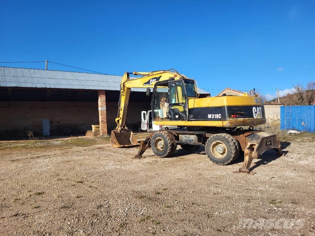 CAT M318c Kolová rýpadla