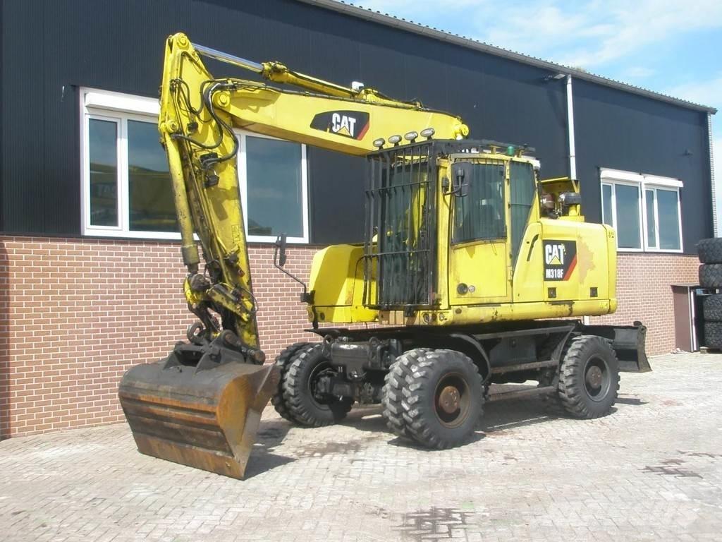 CAT M318F Kolová rýpadla