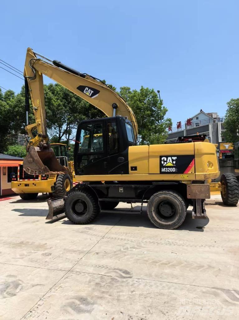 CAT M 320 Kolová rýpadla
