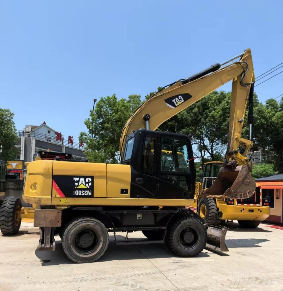 CAT M 320 Kolová rýpadla