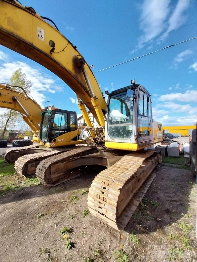 New Holland E 305 Pásová rýpadla