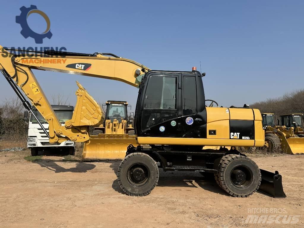 CAT M 320 D2 Kolová rýpadla