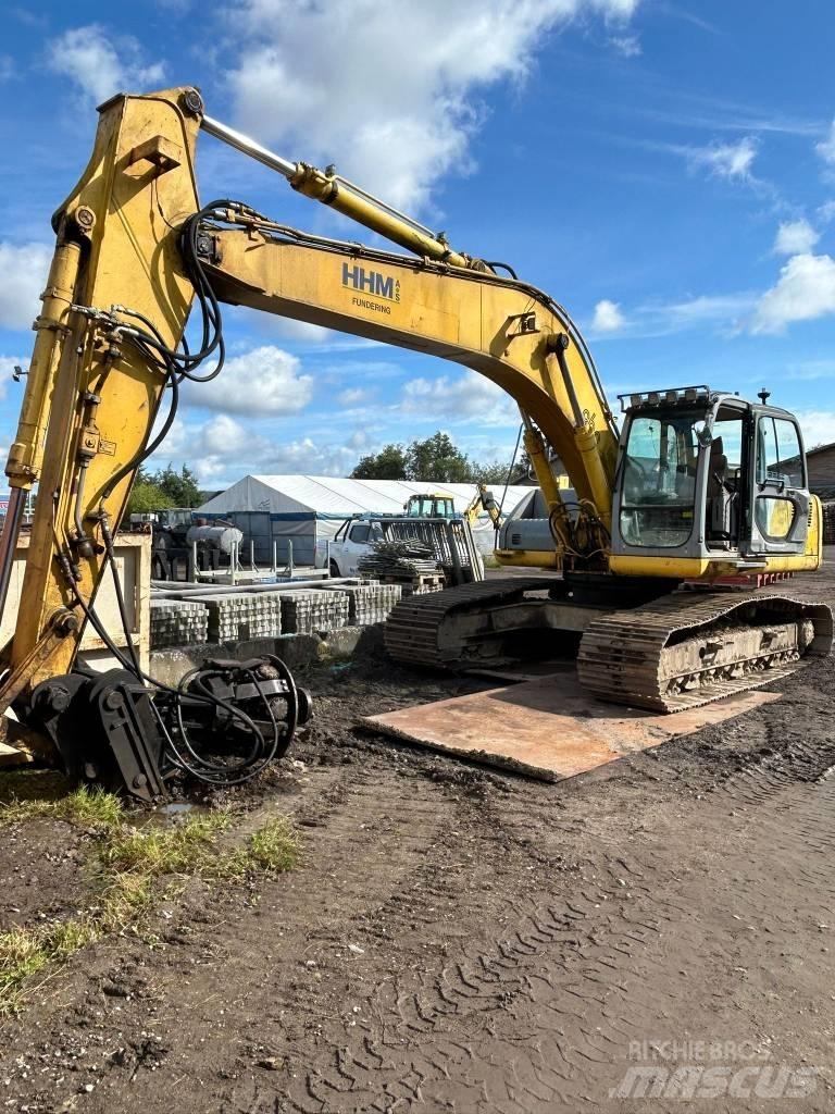New Holland E 265 Pásová rýpadla