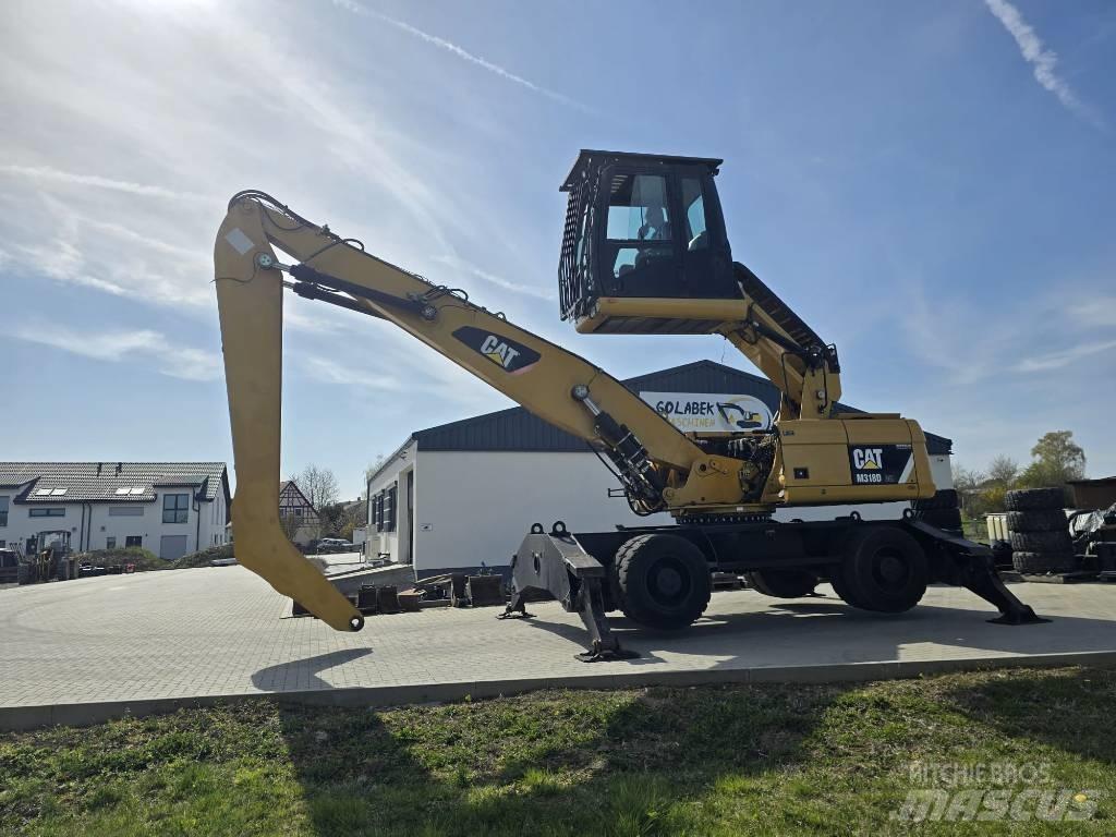 CAT 318D Stroje pro manipulaci s odpadem