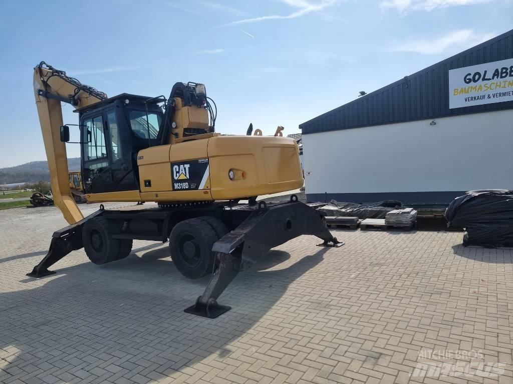 CAT 318D Stroje pro manipulaci s odpadem