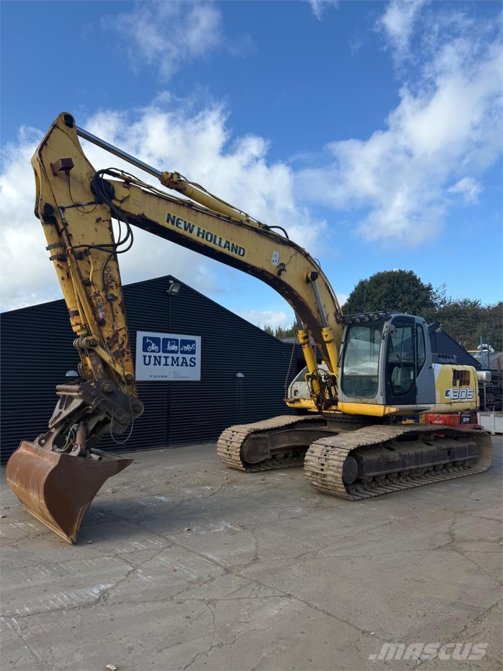 New Holland E305 Pásová rýpadla
