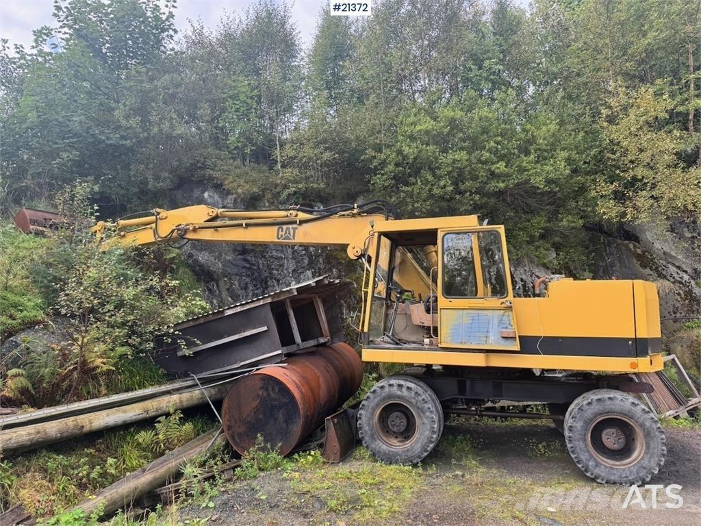 CAT 212B Kolová rýpadla
