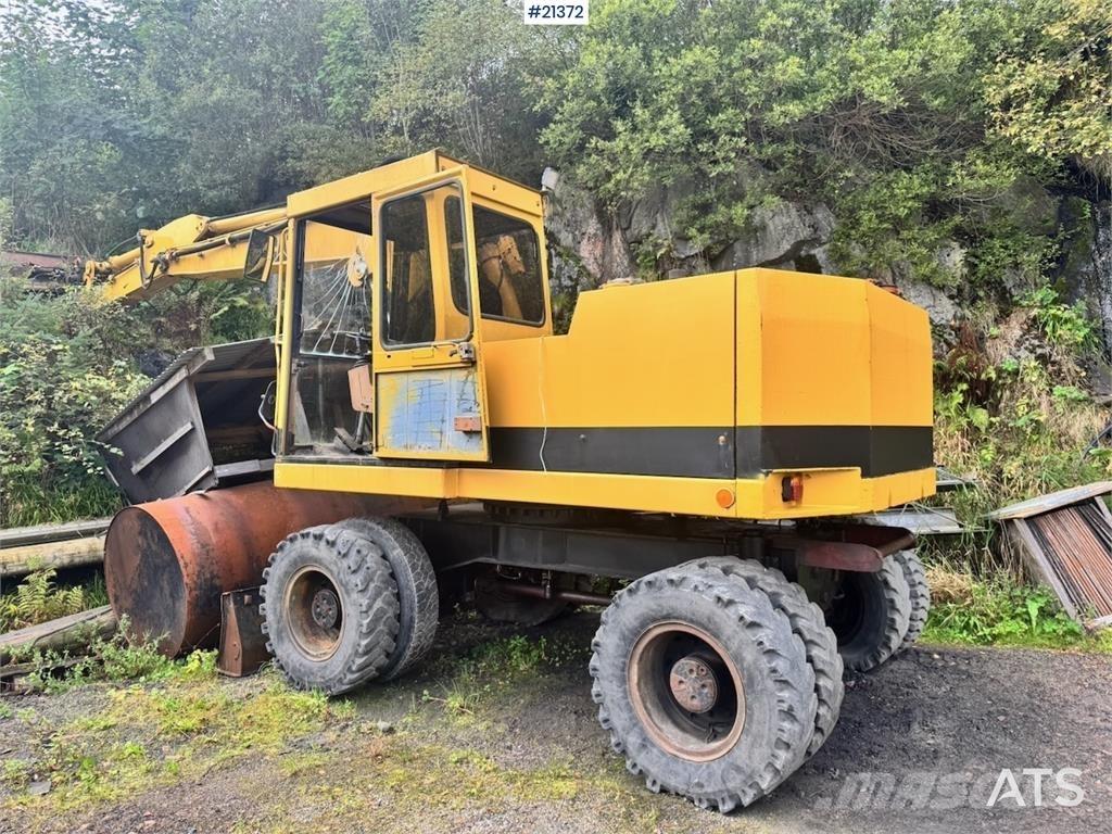 CAT 212B Kolová rýpadla