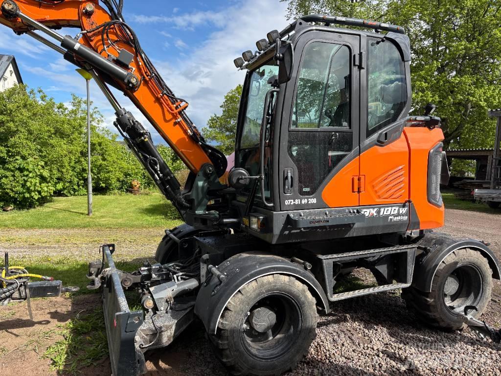 Develon DX 100 W-7 Kolová rýpadla