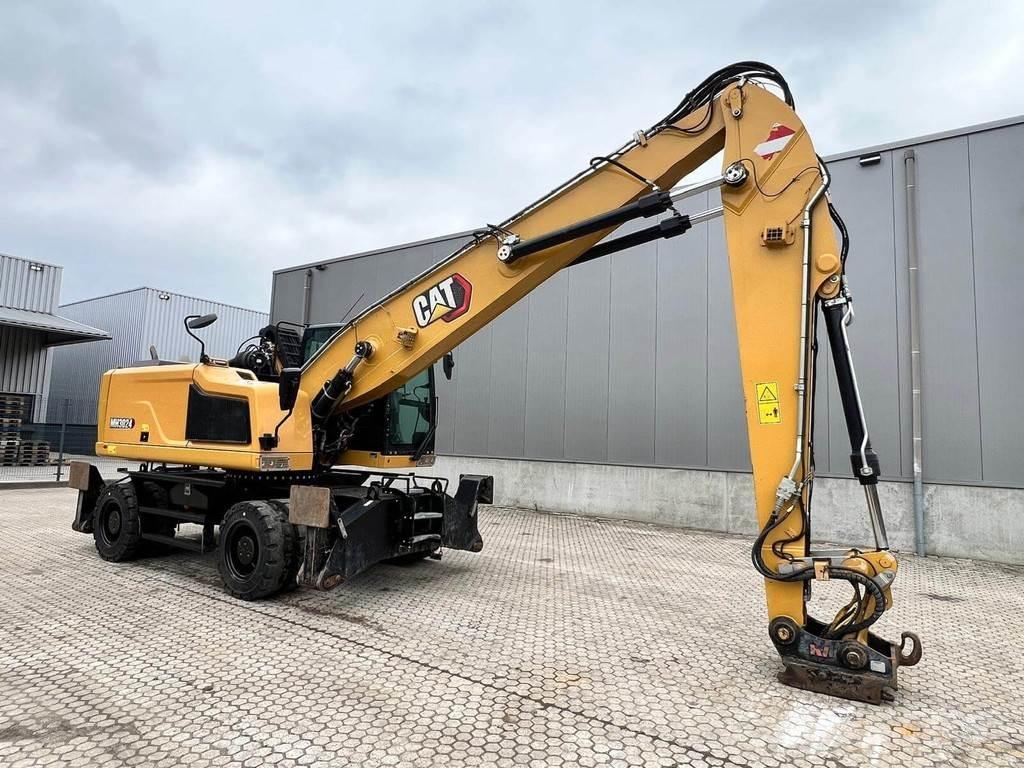 CAT MH3024-06C Stroje pro manipulaci s odpadem