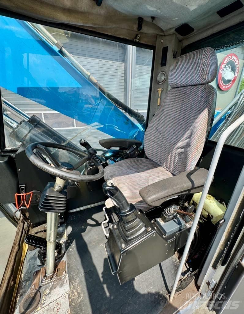 Fuchs MHL 331 Stroje pro manipulaci s odpadem