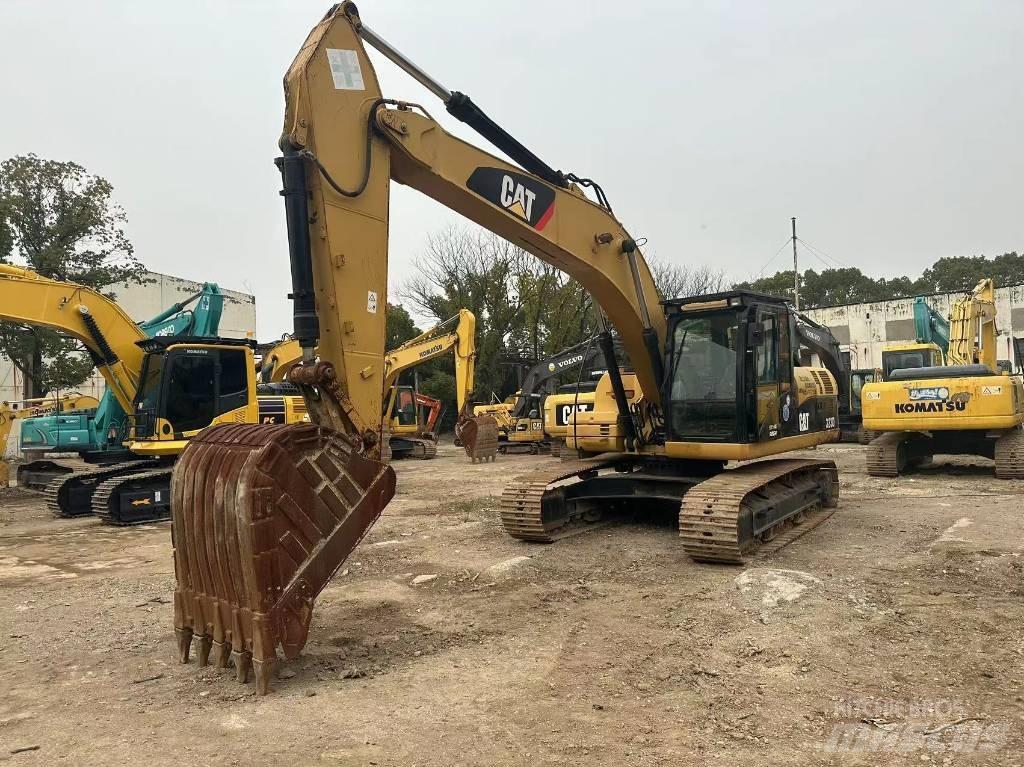CAT 323D Pásová rýpadla
