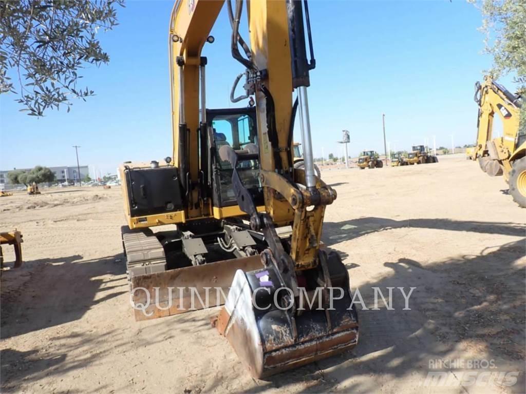 CAT 310 Pásová rýpadla