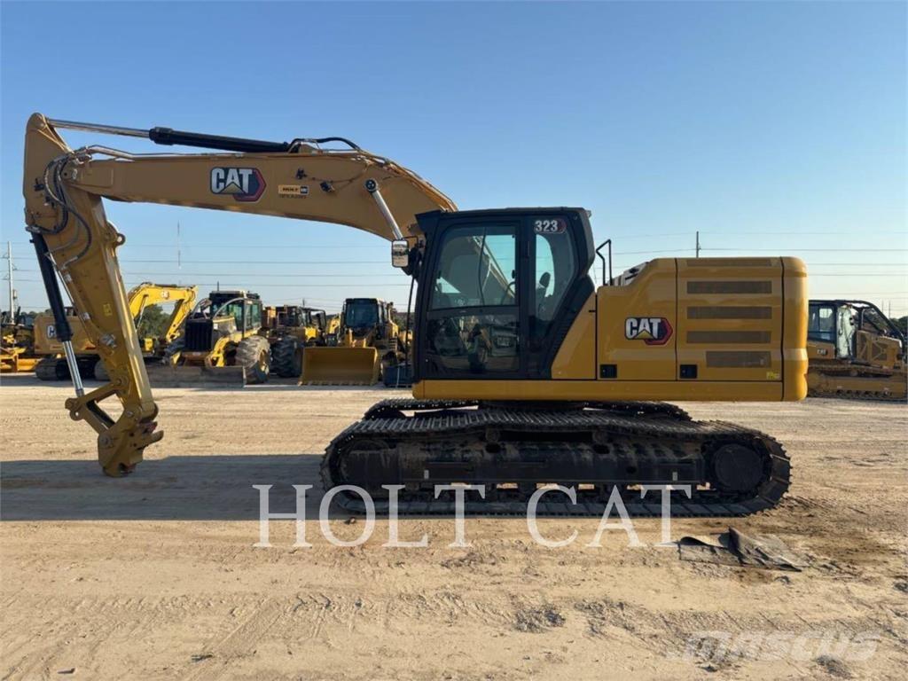 CAT 323 TC Kolové nakladače