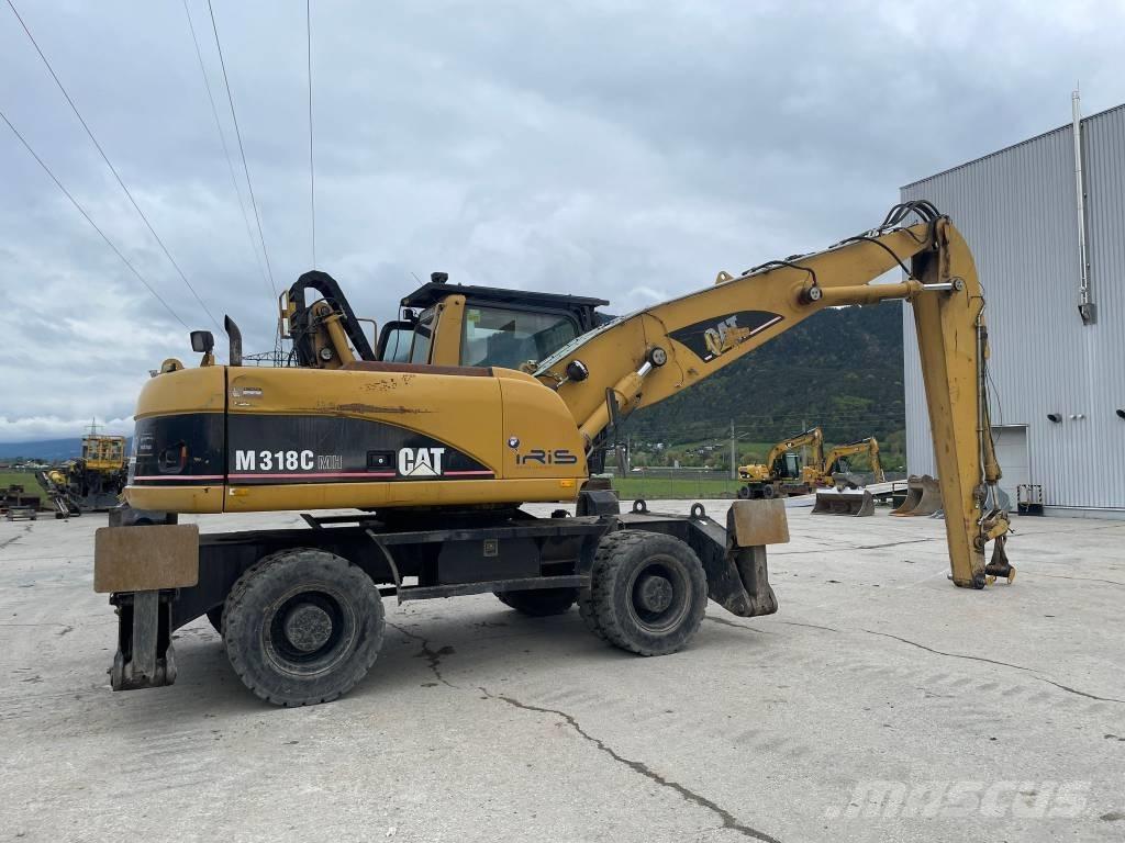 CAT M 318 C MH Stroje pro manipulaci s odpadem