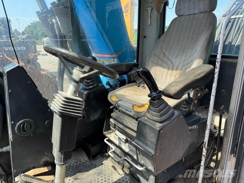 Fuchs MHL 320 Stroje pro manipulaci s odpadem